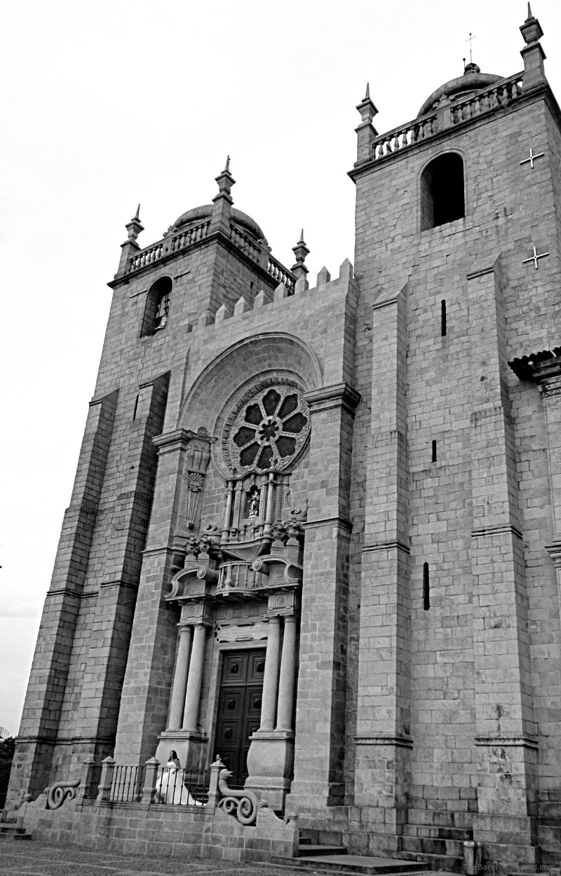 Bride on steps of Cathedral Se Porto Bride on steps of Cathedral Se Porto Portugal black and white