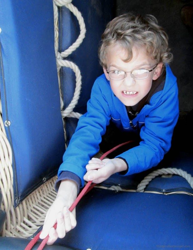 Determined to land the balloon Child helping with the ropes hot air balloon